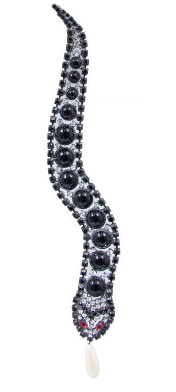 This is a wonderful long snake brooch  with a pearl tongue, by Butler and Wilson.  The pearl moves.