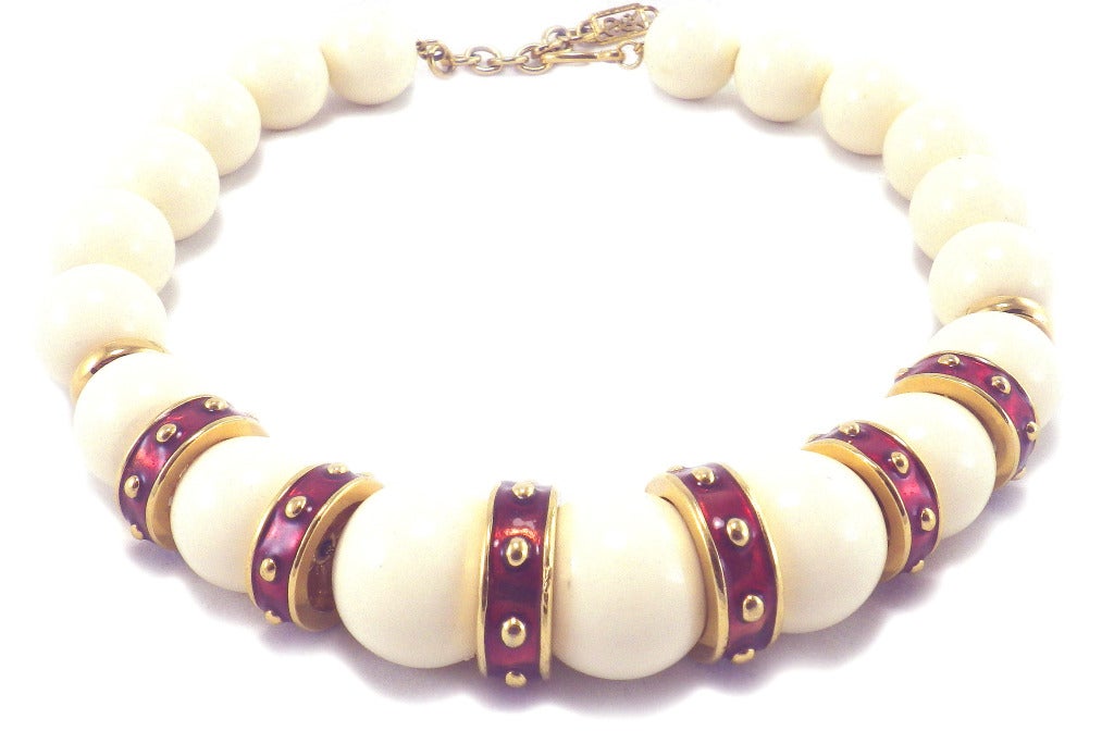 This is a massive galalith bead necklace with enameled gilt metal spacers.  It is 21