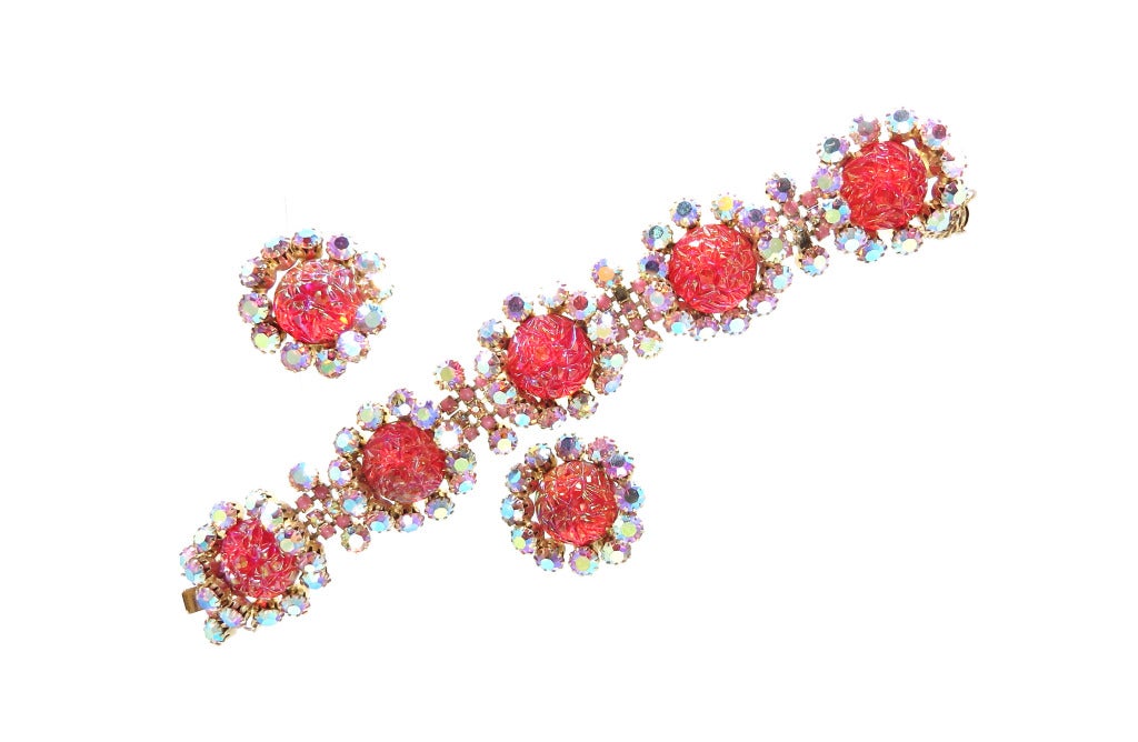 The fire that this Elsa Schiaparelli bracelet and earrings sends out has to be seen to be believed.  Large Gripoix poured glass, lava stones  (sometimes called gum drop stones) are surrounded by 12 brilliant aurora borealis rounds.  The bracelet is