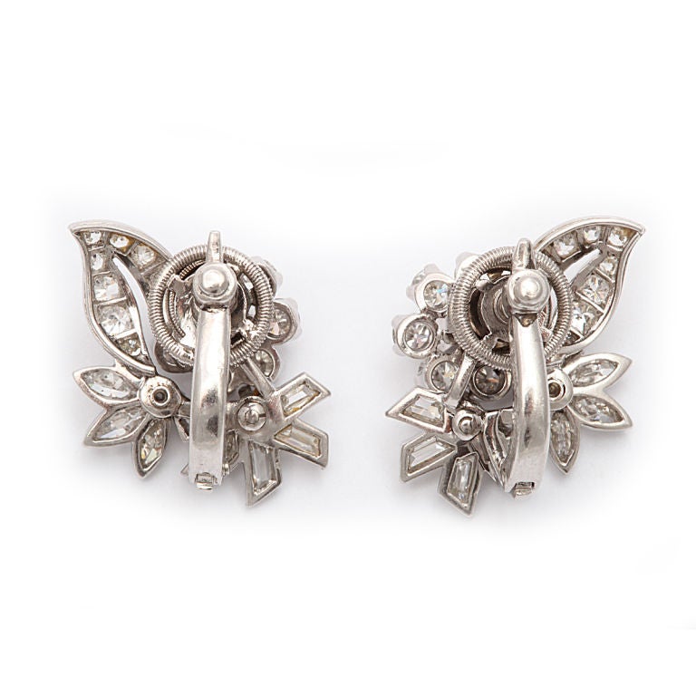 Pair of Cartier, London, diamond floral and foliage earrings, mounted in platinum.