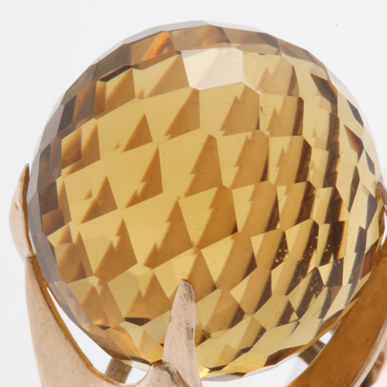 Faceted spherical citrine ring, set in a 14k gold mount.