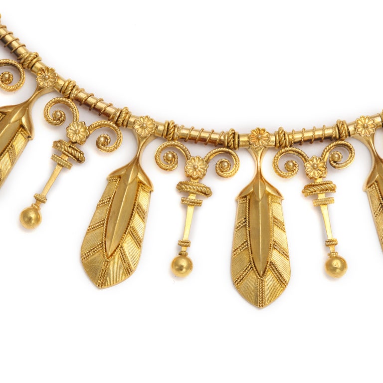 Etruscan Revival gold fringe necklace with palmettes, alternating with floral motifs, by Eugène Fontenay (1823-1887).  The third generation of a family of jewelers known for their exquisite craftsmanship, Fontenay found inspiration in the antique.