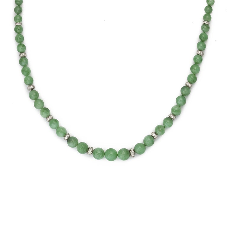 Jade bead necklace with pavé diamond spacers and clasp, set in platinum.