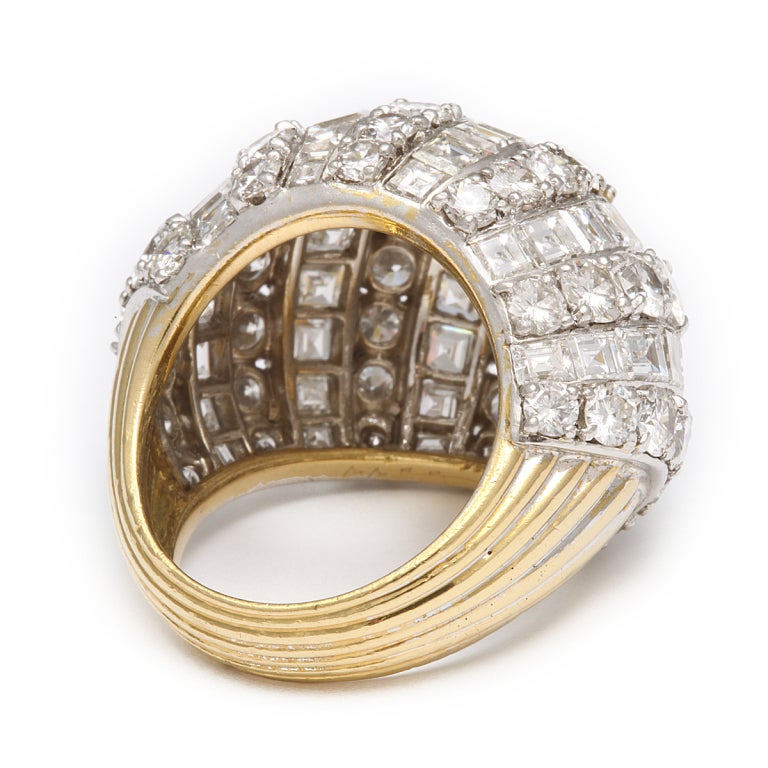 Cartier large diamond bombé ring set in gold and platinum
 
New York, ca. 1960
Width: 3 mm
Approximately 12 cts