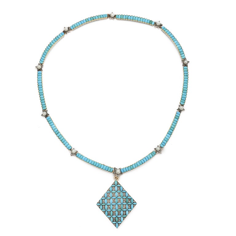 Turquoise-set necklace, ornamented with pearls set in diamond stars, suspending a pendant set with turquoises and diamonds. Mounted in 15ct gold. 

Pendant: ca. 1845
Necklace: ca. 1890
Length of necklace: 16 inches
Length of pendant: 2 inches