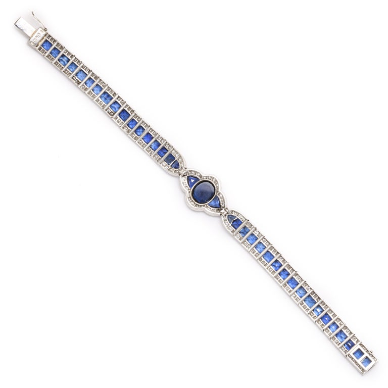 Platinum-set link bracelet composed of sapphires bordered with diamonds. Approximately 23 cts.