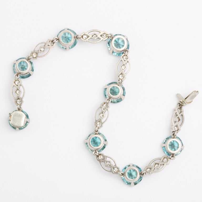Platinum-set link bracelet, featuring blue zircons and diamonds.

(8 zircons approximately 2 cts. each)