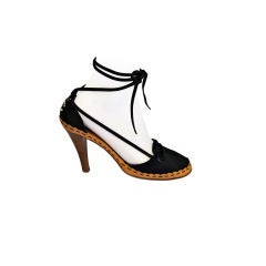 CHANEL black satin 'CC' heels with leather trim and long laces