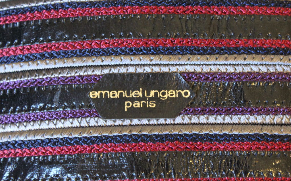 Unique reptile embossed leather belt from Emanuel Ungaro dating to the late 1970's. Colors are grey, purple, burgundy and navy with patinated silver toned buckles.French size 75. Belt measures just over 3