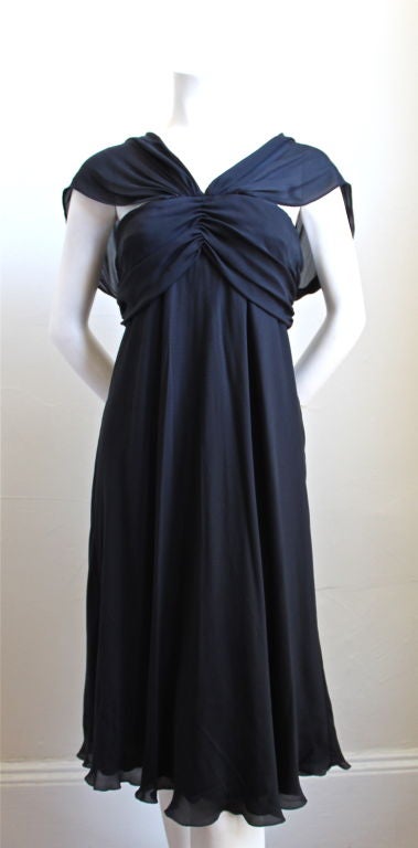 Dramatic black silk chiffon dress with removable beaded detail at neckline from La Perla with built in bra. Size 44. Made in Italy. Fits a US 4-6. New with original tags.