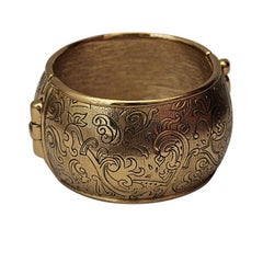 1976 YVES SAINT LAURENT Russian collection gilt cuff with etching
