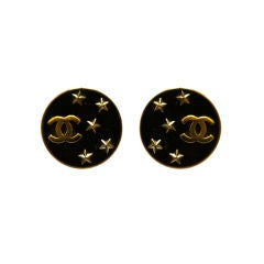 CHANEL black earrings with gilt CCs and stars