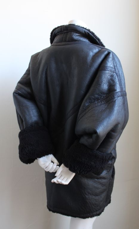 Rare, oversized, jet-black leather coat lined in shearling from Issey Miyake dating to the mid 1980's. Fits a size M or L. Made in Japan. Very good condition.