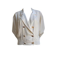 CHANEL BOUTIQUE cream blouse with gilt buttons