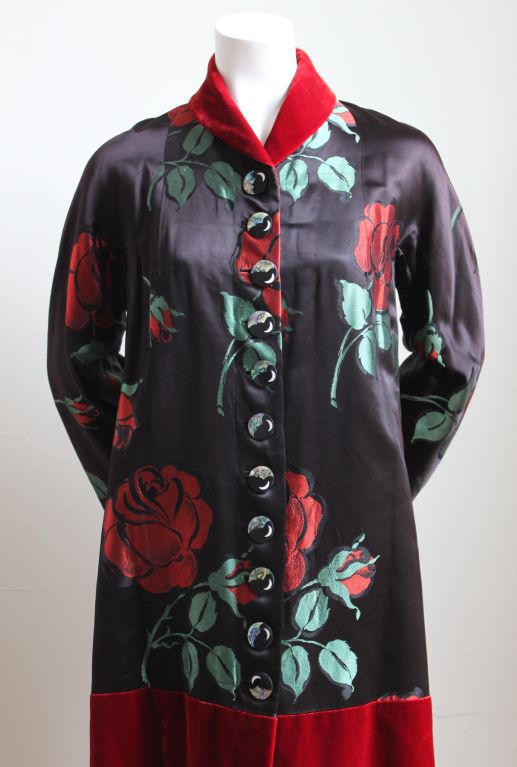 Extremely rare embroidered silk coat with silk velvet and handmade buttons from ELSA SCHIAPARELLI dating to the late 1930's. Fits a size 2 or 4. Made in France. Excellent condition.