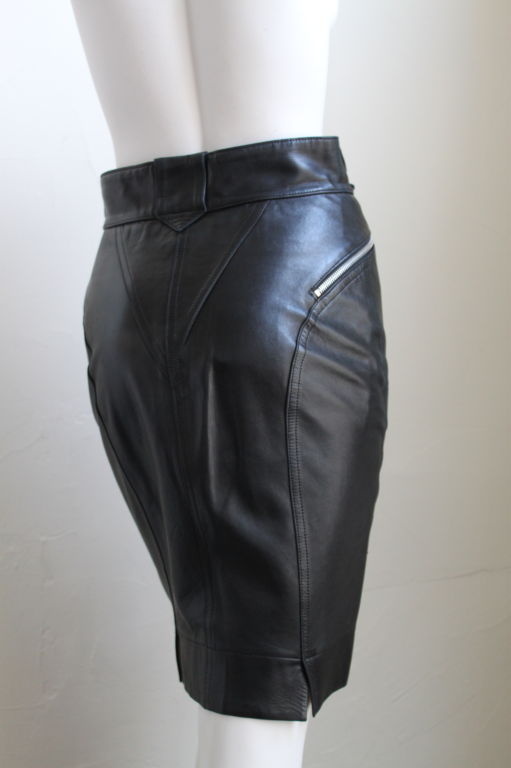 Uniquely seamed jet black leather skirt with zippers from Azzedine Alaia dating to the late 1980's. Labeled a French size 40, which best fits a US 4 or 6 (27