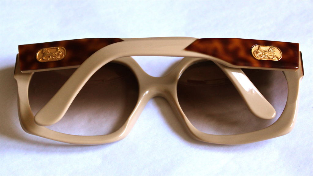 Handmade cream sunglasses with tortoise accent from Celine dating to the late 1970's. Sunglasses fit a medium face. Made in France. Excellent and unworn condition.