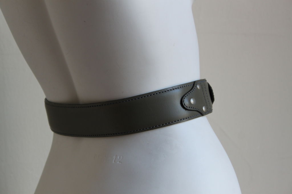 Butter soft light moss green (slightly grar) leather belt with studs at sides from Azzedine Alaia. Labeled a size 65. Made in France. Excellent condition.