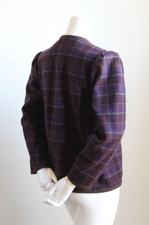 Vivid plaid wool peasant jacket from Yves Saint Laurent dating to the early 1980's. Labeled a French size 34, which best fits a US 2 or 4. Fully lined. Patch pockets at hips. Made in France. Excellent condition.