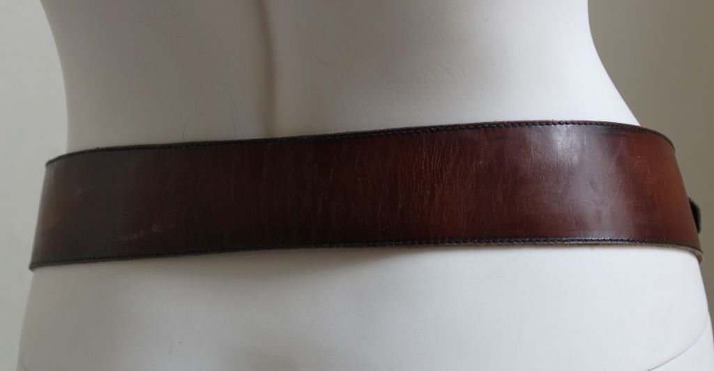 Rich brown leather belt with gilt horse-bit hardware from Celine dating to the 1970's. Labeled a French size 80. Made in France. Very good condition.