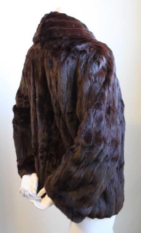 Rich brown French lapin fur coat from Thierry Mugler dating to the early 1990's. Fits a size small or medium. Hook closure. Fully lined. Made in France. Excellent condition.