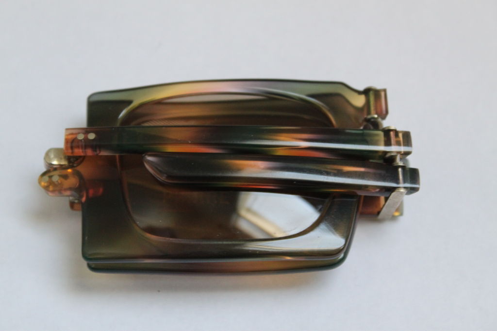 Very rare foldable tortiose sunglasses with original case from Pierre Cardin dating to the 1960's. Folded, the sunglasses measure about 80mm across by 42mm tall and 22mm thick. Unfolded, the sunglasses measure about 154 mm across front and 40 mm