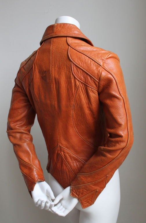 Masterfully cut, rich sienna brown leather jacket from legendary East West Musical Instruments dating to the 1970's.  Size indicated on the label is an 11 although this jacket runs very small - it fits a US size 2-6. Measures approximately 35