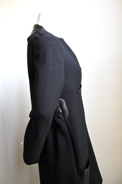 Jet black wool dress with leather pockets, collar and half belt designed by Phoebe Philo for Celine dating to winter 2010/2011. French size 36, which fits a size 4. Slips on over the head. Unlined.  Made in France. New with tags.