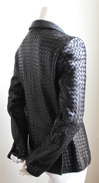 Jet black woven leather blazer from Bottega Veneta. Fits a US size 4-6. Snap and button closure.  Fully lined.  Pockets at hip.  Made in Italy. Excellent condition.