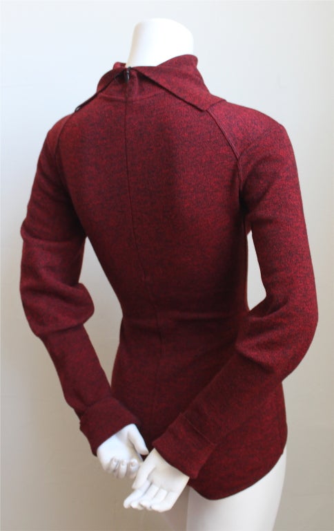 Deep red and black heathered knit bodysuit with amazing seams from Azzedine Alaia dating to the 1990's. Fits a size M. Zips up center back and snaps at crotch. Made in Italy. Excellent condition.