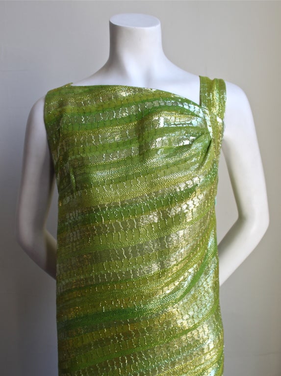 Very rare haute couture chartreuse gown from Balenciaga dating to the 1960's. Gorgeous metallic threads and asymmetrical design. Fits a size 2-6. Made in France. Excellent condition.