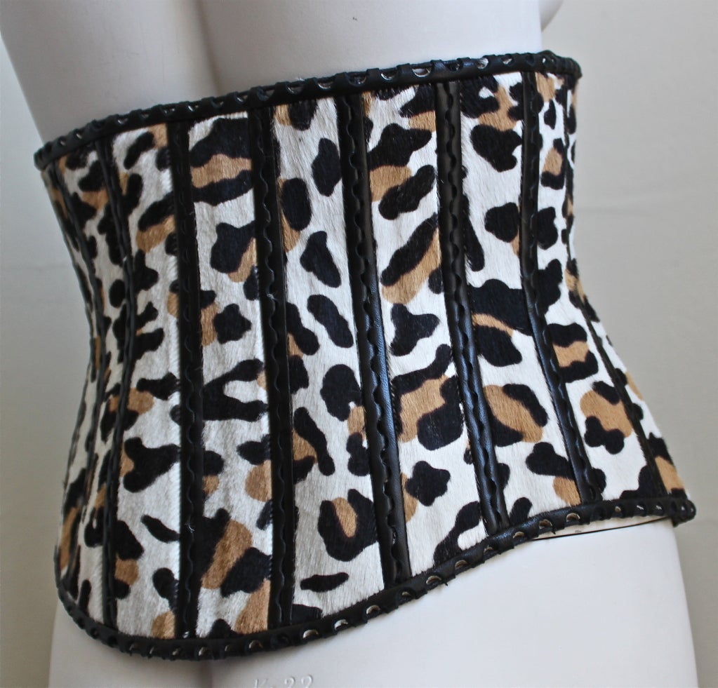 Very dramatic leopard printed pony skin belt with black leather trim from Azzedine Alaia. Best fits a US size 4 or 6 (fit size 2 mannequin on smallest holes). Made in Italy. New with tags.