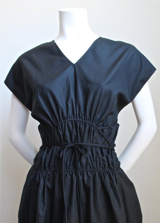 Jet black crisp cotton dress with rushing and lacing from Azzedine Alaia. French size 40. Made in Italy. New with tags