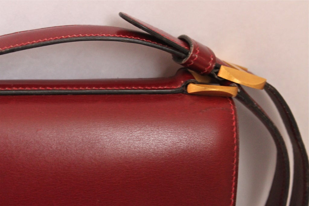 1972 Hermes burgundy leather bag with gilt brushed hardware at 1stdibs