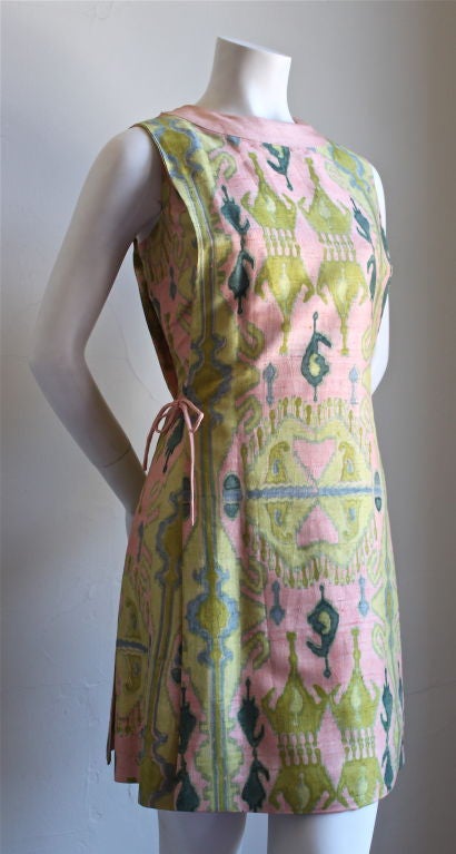 Very rare hand printed silk A line shift from Pierre Cardin dating to the 1960's. Unique tabard style with two layers securing with a tie. Fits a US 4-6. Measures 36