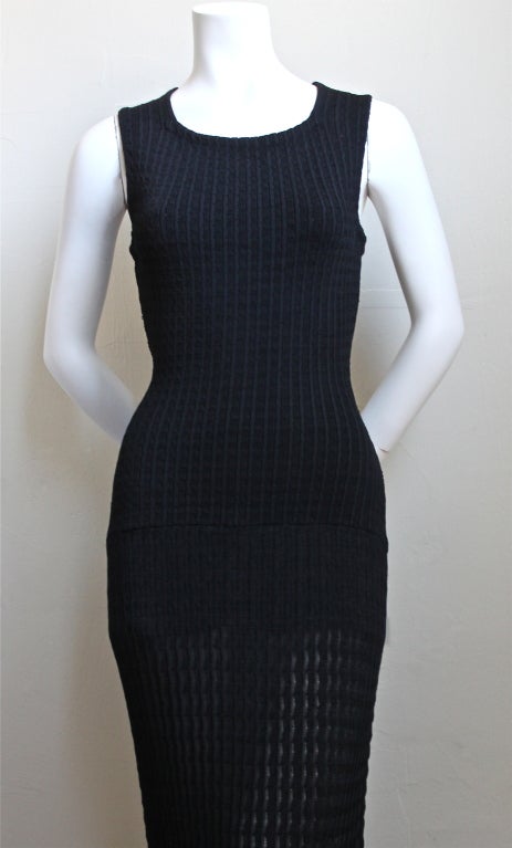 Beautiful jet black knit floor length dress from Azzedine Alaia dating to the 1990's. Fits a size small or medium due to the stretch. Built in shorts with center back zipper. Made in Italy. Very good condition.