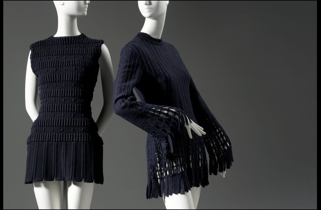 Very rare jet black wool dress with cut outs and fringe from Azzedine Alaia dating to 1991. Fits a size small or slim medium. Measures approximately 33