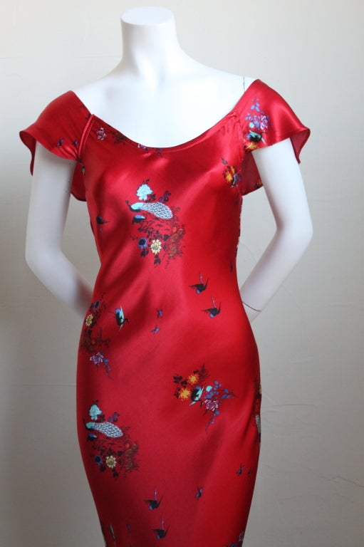 Beautiful handmade peacock printed bias cut gown dating to the 1930's. Fits a size 2-6 due to the bias cut. Slips on over the head. Very good condition with no obvious flaws - very wearable.