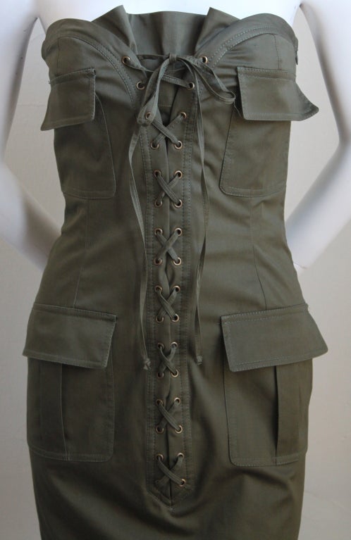 Deep army green strapless safari dress created by Tom Ford for Yves Saint Laurent dating to the early 2000's. Labeled a French size 36 (although this can fit a small busted French 38 as well). Cotton fabric has stretch. Interior corset. Hidden side