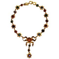 YVES SAINT LAURENT gilt ribbon necklace with faceted glass stars