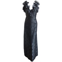 1973 COURREGES black cotton sateen gown with ruffles