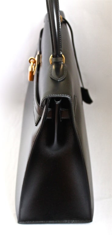Women's HERMES KELLY 35 cm black box leather rigid bag / gold hardware
