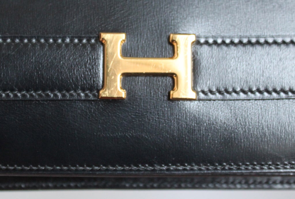 HERMES Annie black box leather clutch with gold hardware and strap ... HERMES Annie black box leather clutch with gold hardware and strap ...