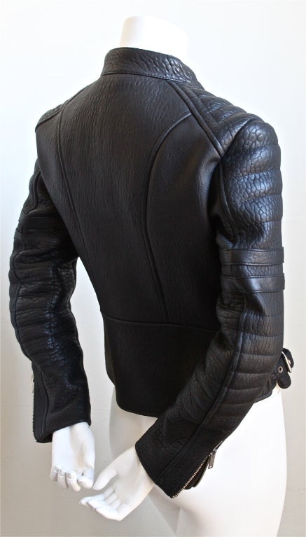 Jet black heavy leather moto jacket with heavy silver hardware and red quilted lining designed by Phoebe Philo for Celine. Labeled a French size 42 although this jacket runs very small -  it best fits a French size 38. Made in Italy. New/unworn