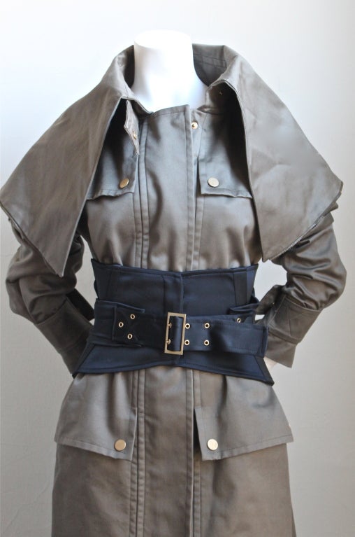 Olive khaki cotton sateen trench coat with black corset belt designed by Tom Ford for Gucci as seen on the runway Fall 2003. Labeled an Italian size 40. Belt best fits a 24-26