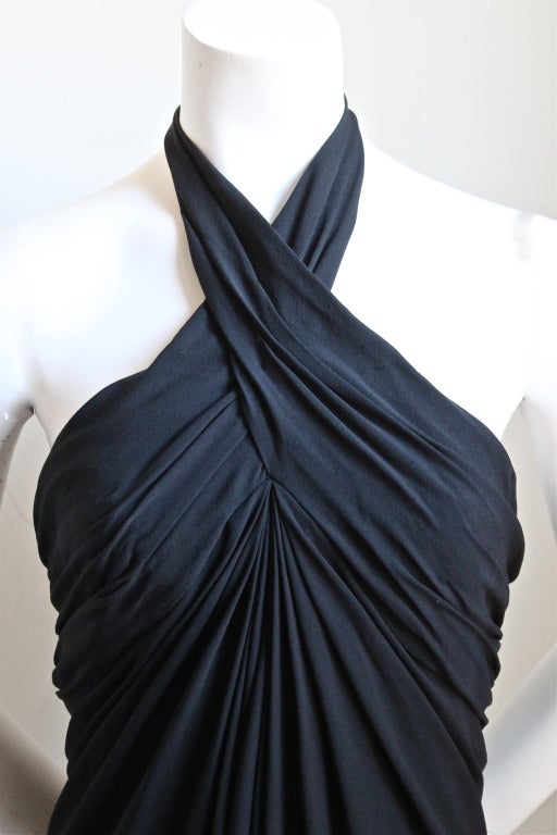 Jet black silk Grecian style gown with halter neck from Oscar de la Renta dating to the late 1980's. Dress best fits a size 2. Mannequin measures 32