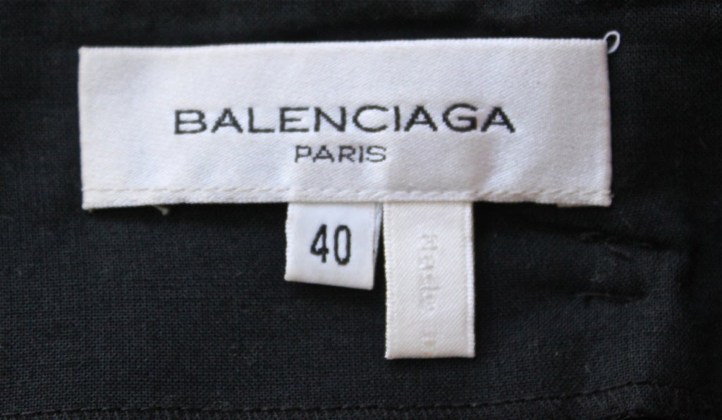 A-line miniskirt with front pleat and textured lattice detail from Nicolas Ghesquière for Balenciaga dating to spring of 2003, exactly as seen on the runway - 'look 1'. Labeled a French 40, although this skirt ran small and would probably better