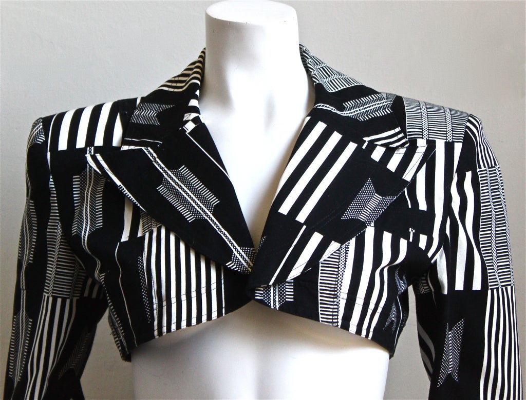 Very rare black and white full circled skirt with matching cropped blazer designed by Patrick Kelly dating to the 1980's.  Fits a size 4 or 6. Jacket measures 17