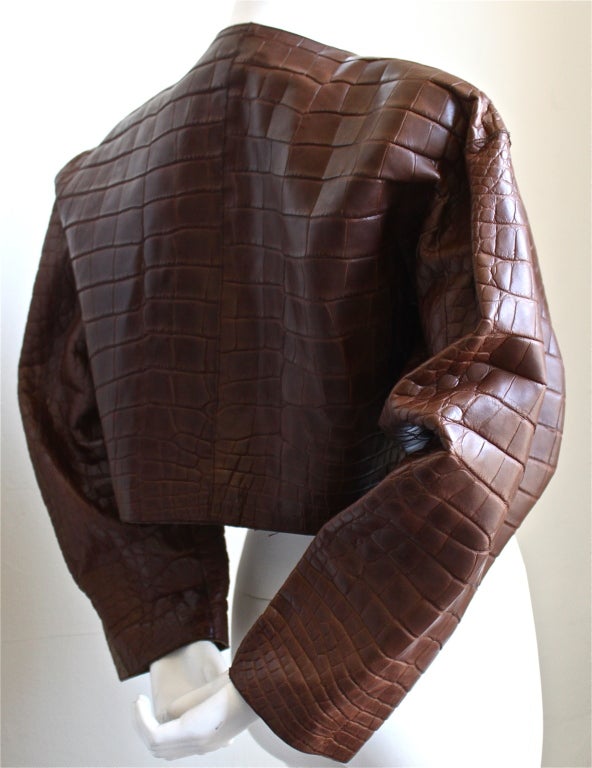 Very rare, rich brown draped jacket made entirely of alligator by Azzedine Alaia dating to 1984. No size indicated. Approximate measurements: shoulder seam to seam 20