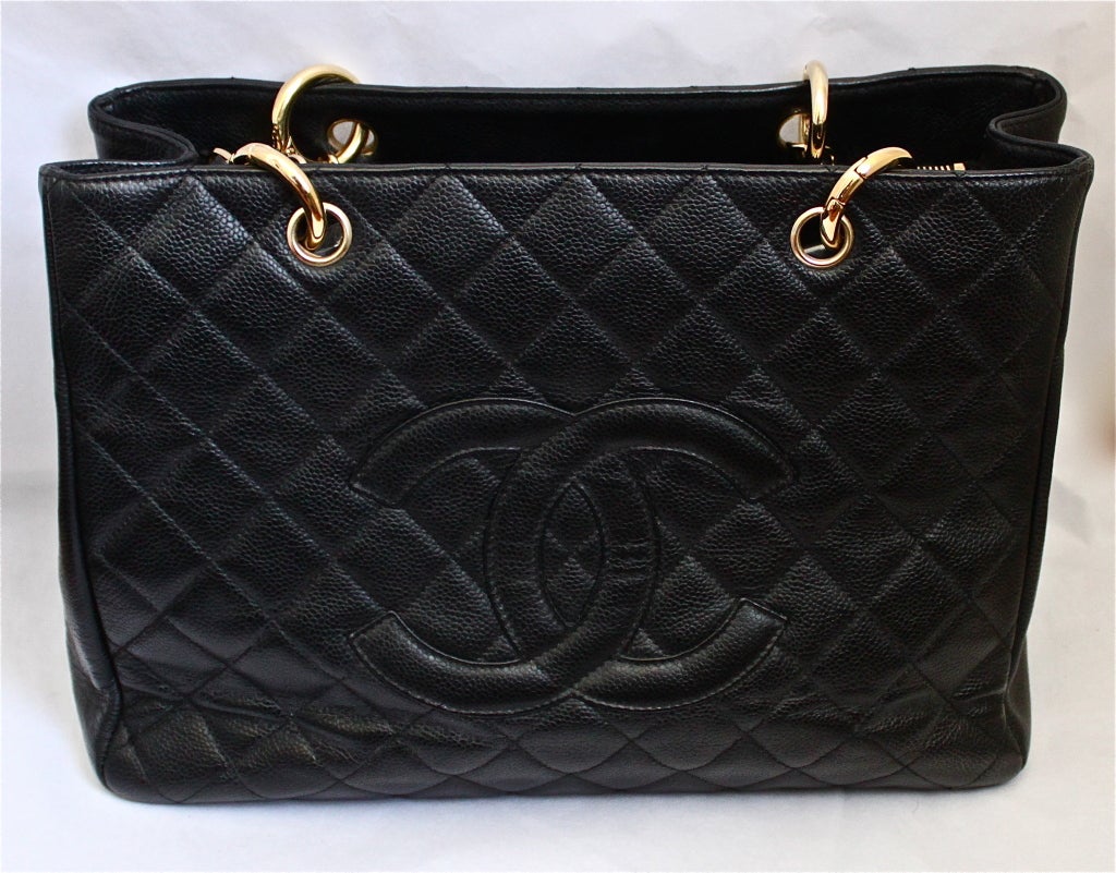 Jet black caviar leather GST tote from Chanel. Bag measures approximately 13.5